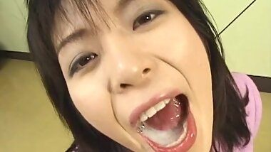 Dark-haired brunette swallows thick cum from black dick