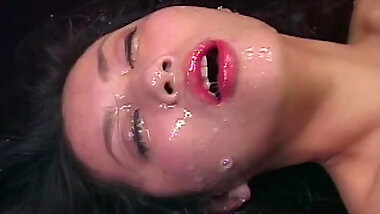 Dark-haired Asian being covered with sperm