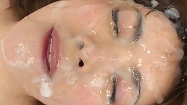 Asian beauty being fully covered with sperm