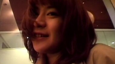 Japanese chick shows off her natural tits