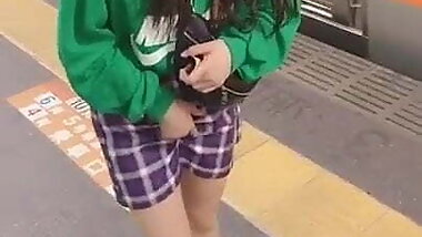 Young woman touching her crotch
