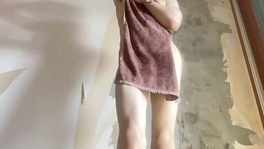 A body covered with a towel after a bath