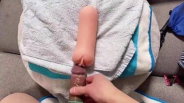 A teen Japanese student puts on a condom and cums a lot in the onahole