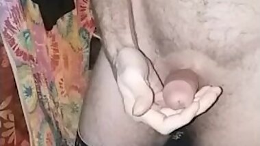 Pants pulled down stroking big dick using lotion and spit. Round three