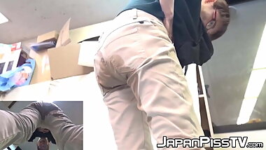 Japanese babe pisses while wearing her pants