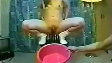 woman washing face with a pee