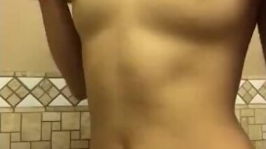 Asian teen girl strips and rubs her body