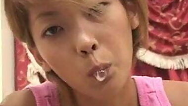 beautiful Japanese girl spitting on the table